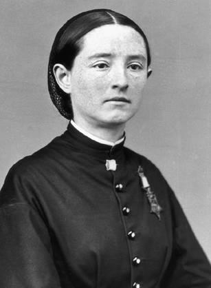 Mary E. Walker sitting with Medal of Honor.