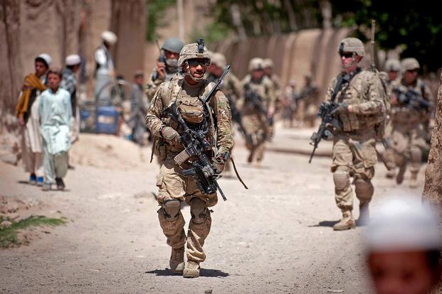 FILE -- Paratroopers with the 82nd Airborne Division's 1st Brigade Combat Team patrol a village in Ghazni Province, Afghanistan, May 29, 2012. (Photo Credit: Sgt. Michael J. MacLeod)