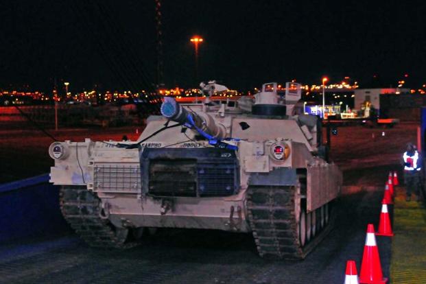 An Army M1 Abrams tank is offloaded from a cargo ship, Jan. 6, 2017, at a port in Bremerhaven, Germany. (Elizabeth Tarr/U.S. Army)
