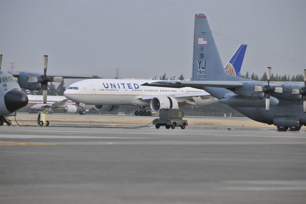 A United Airlines flight lands here March 11, 2011 after diverting from Narita International Airport, Tokyo, Japan. (U.S. Air Force photo/Master Sgt. Kimberly Spinner)