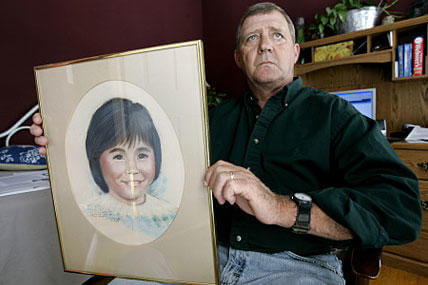Jerry Ensminger holds a portrait of his daughter, Janey. Ensminger has worked since 1997 to raise awareness about toxic wells at Camp Lejeune and get compensation for those adversely affected.