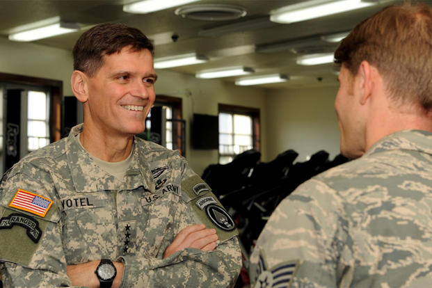 U.S. Army Gen. Joseph Votel speaks with Staff Sgt. Dustin Gorski, a pararescueman, during a visit to the Human Performance Center at Kadena Air Base, Japan Dec. 15, 2014. (U.S. Air Force photo by Airman 1st Class Zade Vadnais)