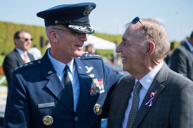 U.S. Air Force Gen. Paul Selva speaks with Ret. Navy Capt. Gerald Coffee after a ceremony commemorating National Prisoner of War (POW) / Missing In Action (MIA) Recognition Day outside the Pentagon, Sept. 16, 2016. (DoD photo/Sgt. James K. McCann)