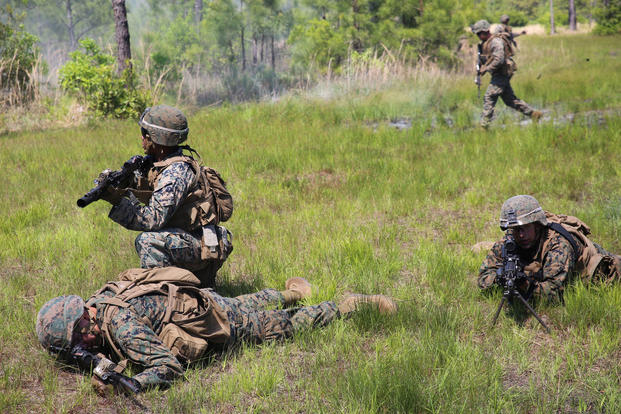 Marines provides security while waiting to safely evacuate an injured Marine after a simulated Improvised Explosive Device explosion during a field training exercise at Camp Lejeune, N.C., May 3, 2017. (U.S. Marine Corps photo/Lance Cpl. Patrick Osino)