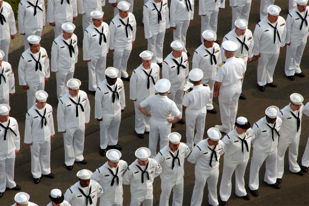 Sailors stand ready to be inspected. (Navy Photo)
