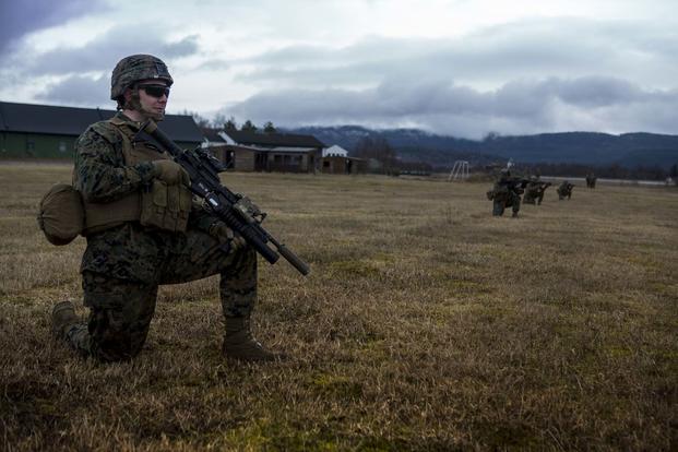 U.S. Marine Lance Cpl. Raymond Jastrzebski Jr., a rifleman with Marine Rotational Force Europe 17.1 takes a tactical pause during a squad patrol in Vaernes Garnison, Norway, April 7, 2017. (U.S. Marine Corps/Lance Cpl. Sarah N. Petrock)