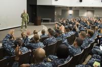 Rear Adm. John Wade, commander of Naval Surface and Mine Warfighting Development Center, speaks with students at the Surface Warfare Officer School Command's Basic Division Officer Course at Naval Base San Diego (U.S. Navy/Christopher E. Tucker)