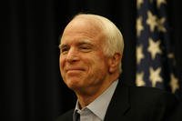 Arizona Sen. John McCain, a POW in North Vietnam for nearly five years, now battles a form of brain cancer that is usually terminal. He has urged colleagues in Congress to stop listening to &quot;the bombastic loudmouths on the radio and on the Internet.&quot; The former presidential candidate has long been committed &quot;to serve a cause greater than oneself.&quot; (US Marine Corps photo/Bill Lisbon)