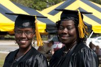 Mother and daughter Sandra and Nathenia Wells completed and associate of arts in general studies degrees and walked the stage at the Fort Bragg Colleges and Universities Graduation and Recognition Ceremony. (U.S. Army/Amber Avalona)