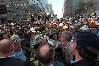 The president greets firefighters, police and rescue personnel, Sept. 14, 2001, while touring the site of the World Trade Center terrorist attack in New York. (Photo by Eric Draper, Courtesy of the George W. Bush Presidential Library)