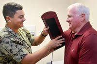Hospitalman Addis Murray takes retired senior chief Dennis Bennett’s blood pressure at Naval Hospital Jacksonville’s Family Medicine clinic. (U.S. Navy/Jacob Sippel)