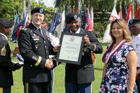 Lt. Col. Antonio Copeland receives his certificate of retirement from Maj. Gen. Pete Johnson, U.S. Army Pacific deputy commanding general-south, during a celebration of service ceremony. (U.S. Army/Justin Silvers)
