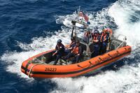 Coast Guard Cutter Bertholf crewmembers aboard a 26-foot Mark IV small boat approach the cutter during a counterdrug patrol in the Eastern Pacific Ocean, March 8, 2018. (U.S. Coast Guard/Petty Officer 1st Class Matthew S. Masaschi)