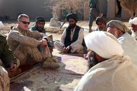 U.S. Marine Corps Capt. Jason C. Brezler, with 3rd Battalion, 4th Marine Regiment, meets with Afghan leaders in Now Zad, Afghanistan, on Dec. 15, 2009. (U.S. Marine Corps/ Cpl. Albert F. Hunt)