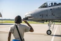 Senior Airman Tori Payne salutes a pilot from the 74th Fighter Squadron prior to takeoff for Little Rock AFB, Ark., Aug. 30, 2019, at Moody Air Force Base, Ga. Moody’s A-10C Thunderbolt II’s were relocated to Little Rock in anticipation of Hurricane Dorian. (U.S. Air Force/Airman 1st Class Eugene Oliver)