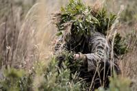 A Marine student undergoing the 2nd Marine Division Combat Skills Center’s Pre-Scout Sniper Course prepares to move during a stalking exercise at Camp Lejeune, N.C., Jan. 22, 2016. (U.S. Marine Corps/Cpl. Paul S. Martinez)