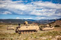 A Mission Enabling Technologies-Demonstrator nd two Robotic Combat Vehicles maneuver through a Fort Carson training area