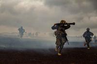 Marines maneuver from a gassed area during Exercise Bougainville II.