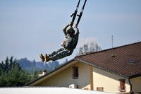 Paratrooper prepares to land during basic airborne refresher course.