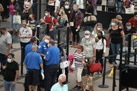 Travelers in the line for the security checkpoint in the Denver International Airport.