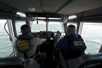 Maritime Safety and Security Team Galveston members patrol Lake Amistad, Texas, with a U.S. Border Patrol agent.