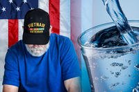 Veteran and glass of water and American flag in background