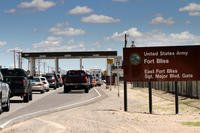 Cars wait to enter Fort Bliss.