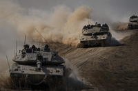 Israeli tanks head towards the Gaza Strip border in southern Israel