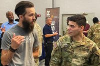 U.S. Army Sgt. Euleam Aviles attends a national job fair at Fort Stewart, Georgia.