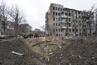 rubble in front of a residential building damaged by a Russian missile strike in Kharkiv