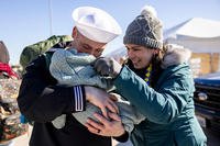 Aviation machinist's mate Raymond Dillon holds his 5-day-old baby girl Eleanor with his wife Jana at Naval Station Norfolk