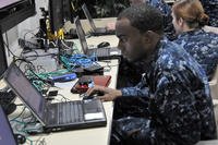 Information Systems Technician Seaman Apprentice Wesley Bryant, assigned to the amphibious assault ship USS Boxer (LHD 4), sets up a computer server administrator account on a virtual server during a training course provided by Space and Naval Warfare Systems Command (SPAWAR).