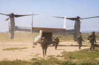 U.S. Marines disembark an MV-22B Osprey