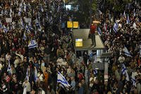 People take part in a protest against Israeli Prime Minister Benjamin Netanyahu's government