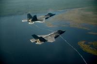 An F-22A Raptor (top) from the 43rd Fighter Squadron at Tyndall Air Force Base, Fla., and an F-35A Joint Strike Fighter from the 33rd Fighter Wing at Eglin Air Force Base, Fla., fly in formation on Sept. 19, 2012. (US Air Force photo/Jeremy  Lock)