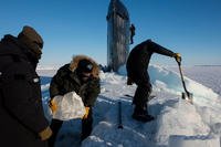 Sailors and civilians, assigned to Arctic Submarine Lab, clear the ice from the hatch of USS Hampton (SSN 767) during Ice Exercise (ICEX) 2016. (Photo: Mass Communication Specialist 2nd Class Tyler Thompson)