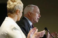 Arizona Republican Sen. John McCain, right, speaks to the crowd as wife Cindy McCain applauds her husband at election night festivities Tuesday, Nov. 4, 2014, in Phoenix. (AP Photos/Ross D. Franklin)
