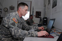 Spc. Robert Anderson with the 328th Engineer Company uses a computer at the Fort McCoy Mobilization Soldier Computer Center. (Photo: Tom Michele, Fort McCoy)