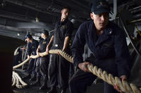 Sailors assigned to USS Nimitz (CVN 68) prepare to heave around on a line on the ship's fantail as the ship departs Naval Air Station North Island. (U.S. Navy /Seaman Weston A. Mohr)
