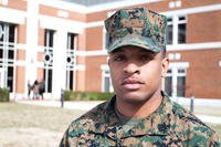 Marine standing on college campus