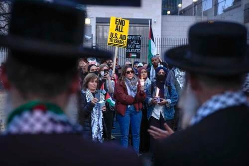 Demonstrators gather during a vigil outside the Israeli Embassy, Monday, Feb. 26, 2024, in Washington.