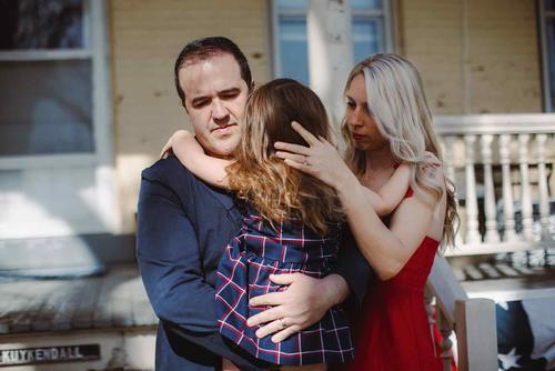 Army Capt. Jeremy Kuykendall and his wife Kate, cradle their daughter