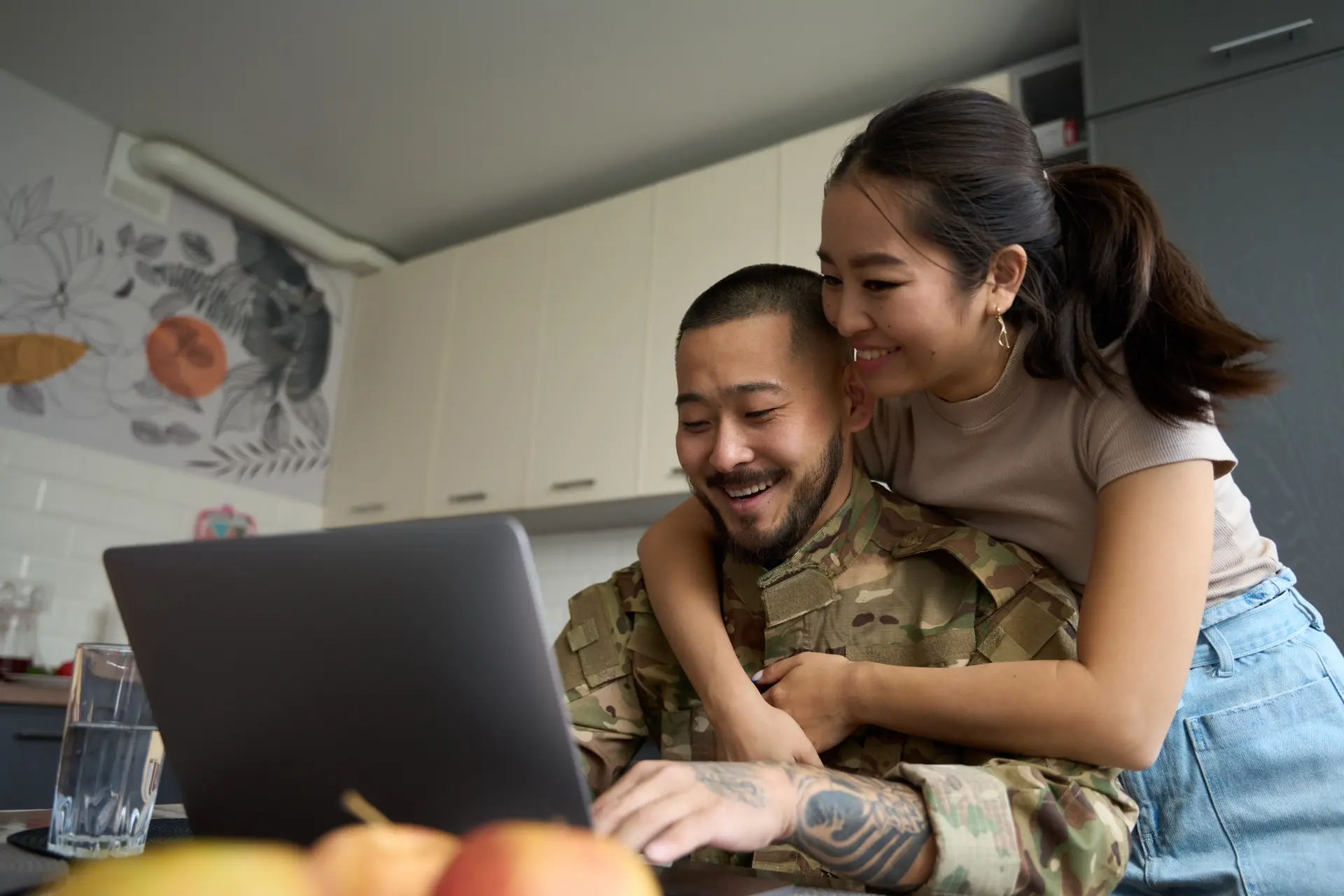 military member holding child